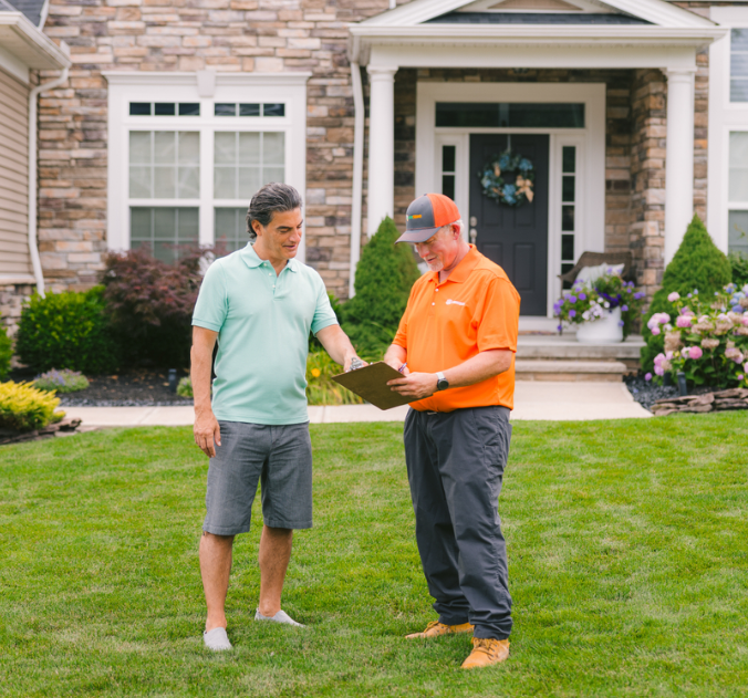 two men standing in a lawn